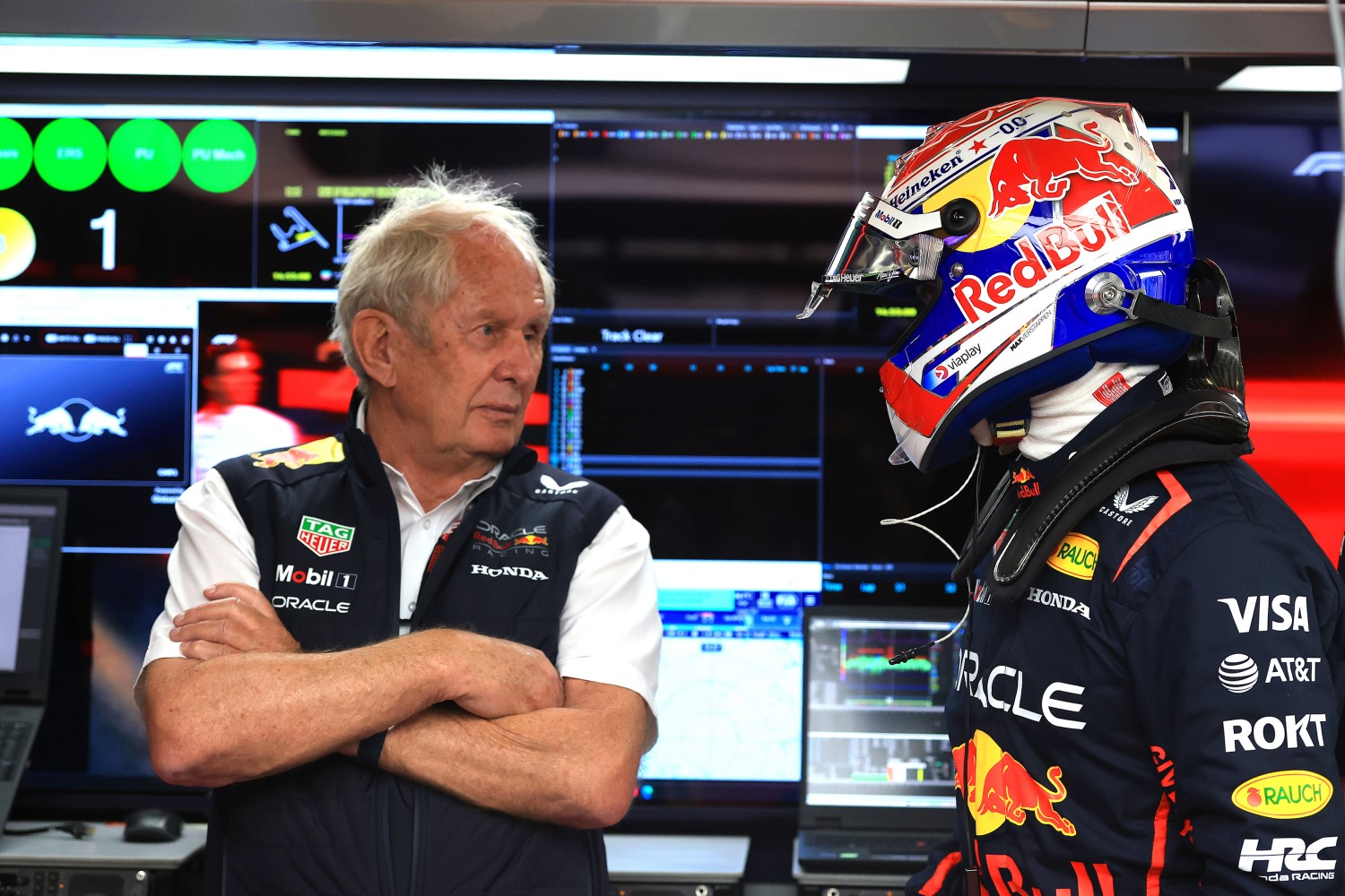 Dr Helmut Marko, Team Consultant of Oracle Red Bull Racing and Max Verstappen of the Netherlands and Oracle Red Bull Racing talk in the garage during qualifying ahead of the F1 Grand Prix of China at Shanghai International Circuit on March 22, 2025 in Shanghai, China. (Photo by Mark Thompson/Getty Images) // Getty Images / Red Bull Content Pool