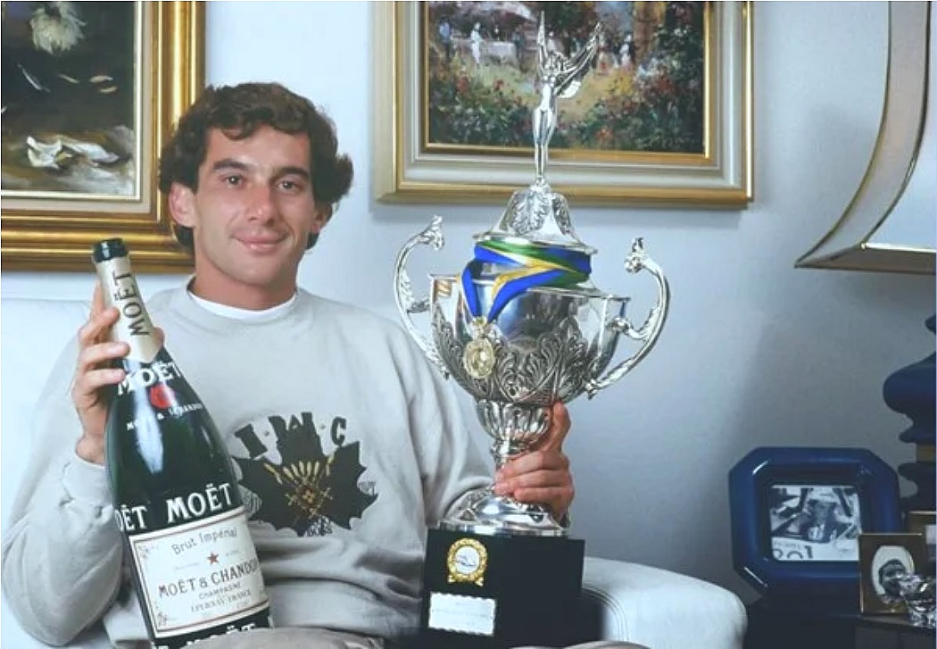 Ayrton Senna celebrates his win with a bottle of Moët & Chandon. Photo Courtesy of Moët & Chandon.