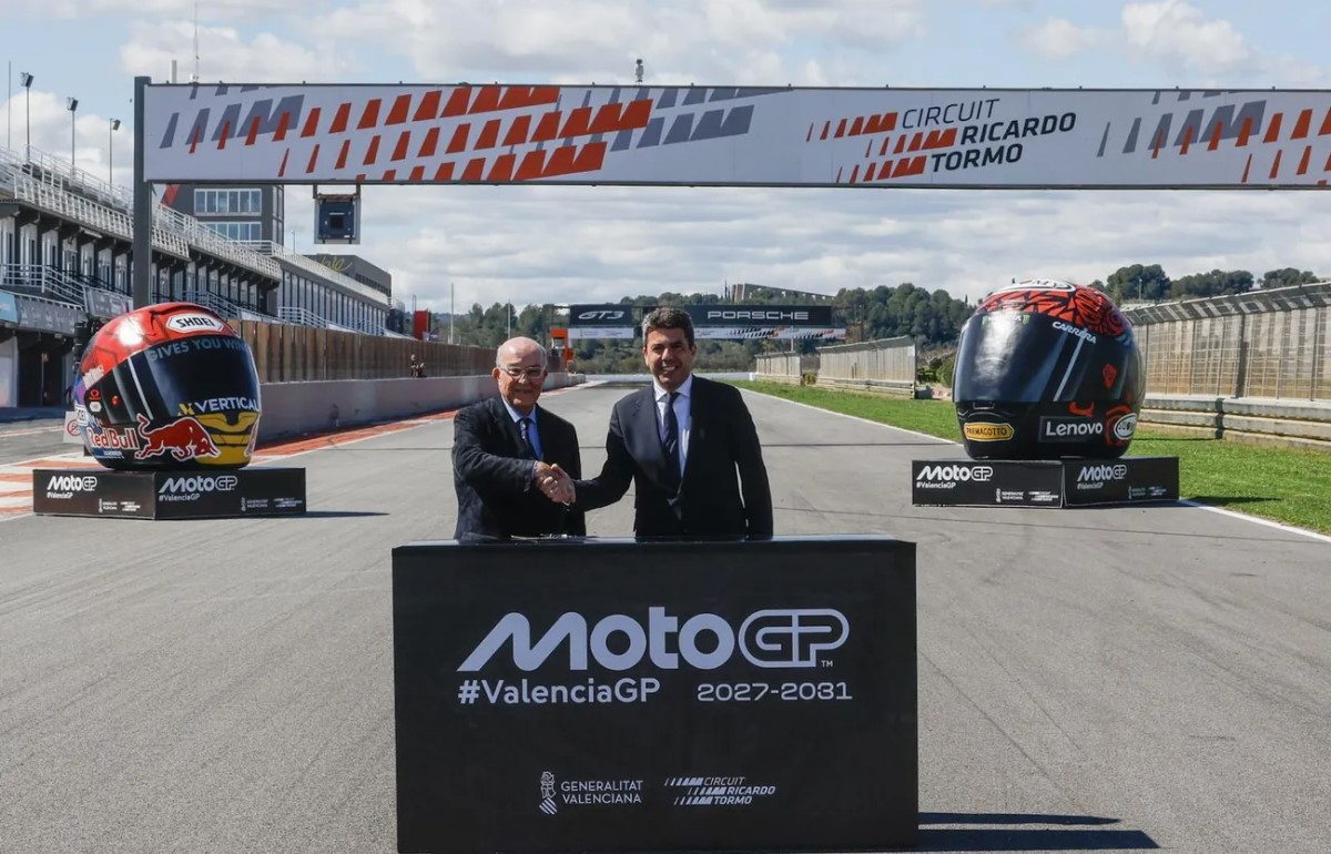 Carmelo Ezpeleta, CEO of MotoGP (Left) shakes hands on the new Valencia deal with Carlos Mazon, President of the Generalitat Valenciana