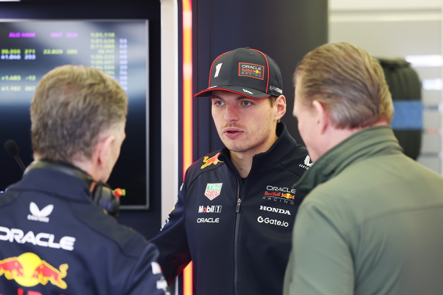 Max Verstappen of the Netherlands and Oracle Red Bull Racing, Jos Verstappen, and Christian Horner, Team Principal of Oracle Red Bull Racing talk in the garage (Photo by Mark Thompson/Getty Images) // Getty Images / Red Bull Content Pool