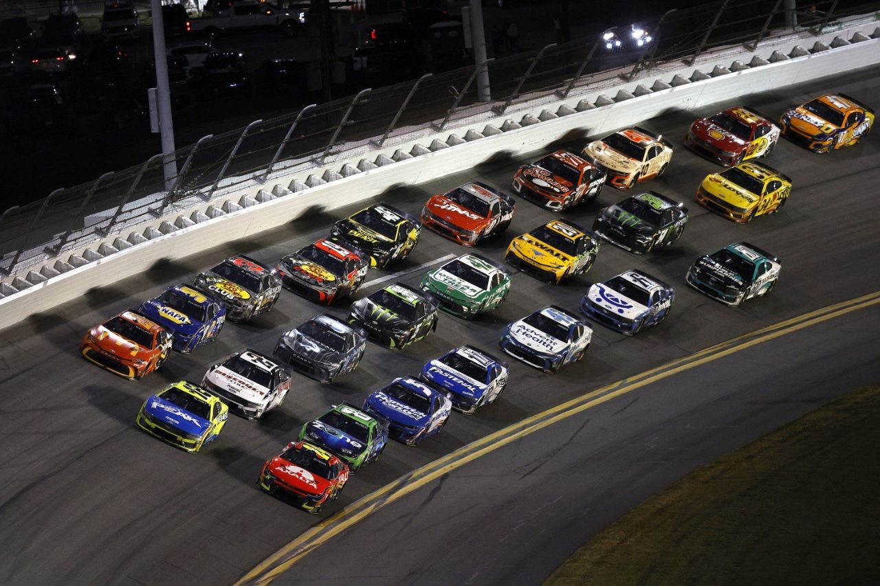 William Byron, driver of the #24 Axalta Chevrolet, Ryan Blaney, driver of the #12 Menards/Peak Ford and Bubba Wallace, driver of the #23 McDonald's Toyota race during the NASCAR Cup Series Daytona 500 at Daytona International Speedway on February 16, 2025 in Daytona Beach, Florida. (Photo by Sean Gardner/Getty Images)