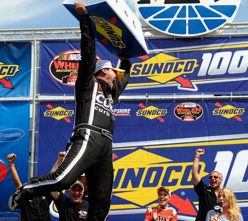 Bobby Santos, driver of the #44 Tinio Racing/ImperialCars.com Chevrolet, celebrates in victory lane after winning the NASCAR Whelen Modified Tour Sunoco 100 at New Hampshire Motor Speedway on July 12, 2014 in Loudon, New Hampshire. (Photo by Jeff Zelevansky/NASCAR via Getty Images for NASCAR)