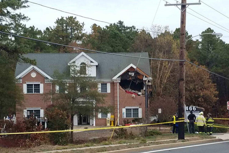 Porsche flies 20-feet in air and into building