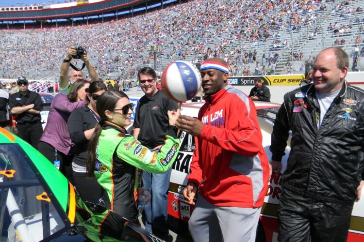 Danica Patrick spins with Harlem Globetrotter