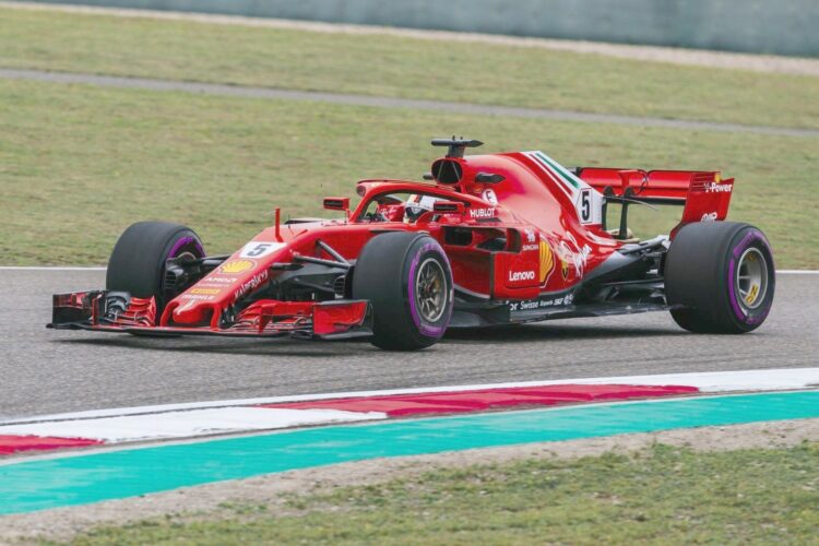 Vettel nips Raikkonen for all-Ferrari front row