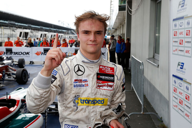 Lucas Auer claims the winner’s trophy at the Nurburgring