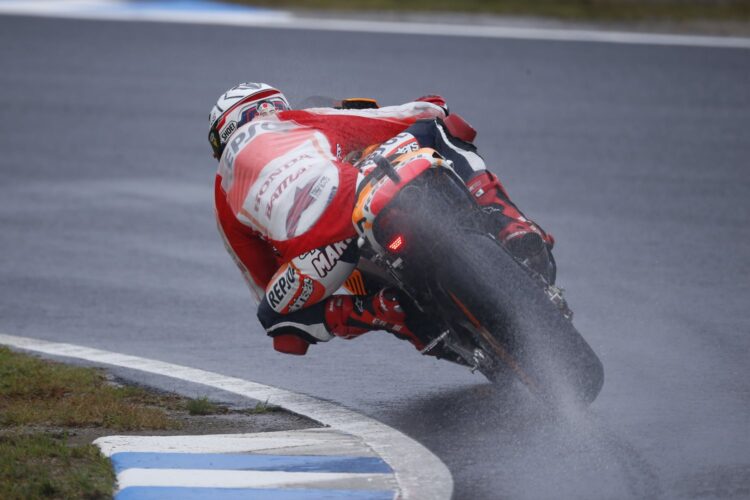 Lorenzo storms to pole at wet Motegi