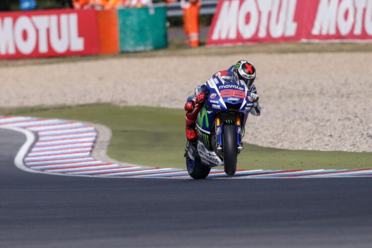 Lorenzo destroys lap record to take pole