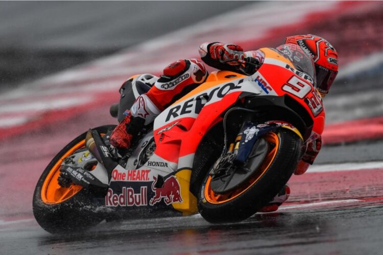 Marquez makes last lap pass to win at wet Misano