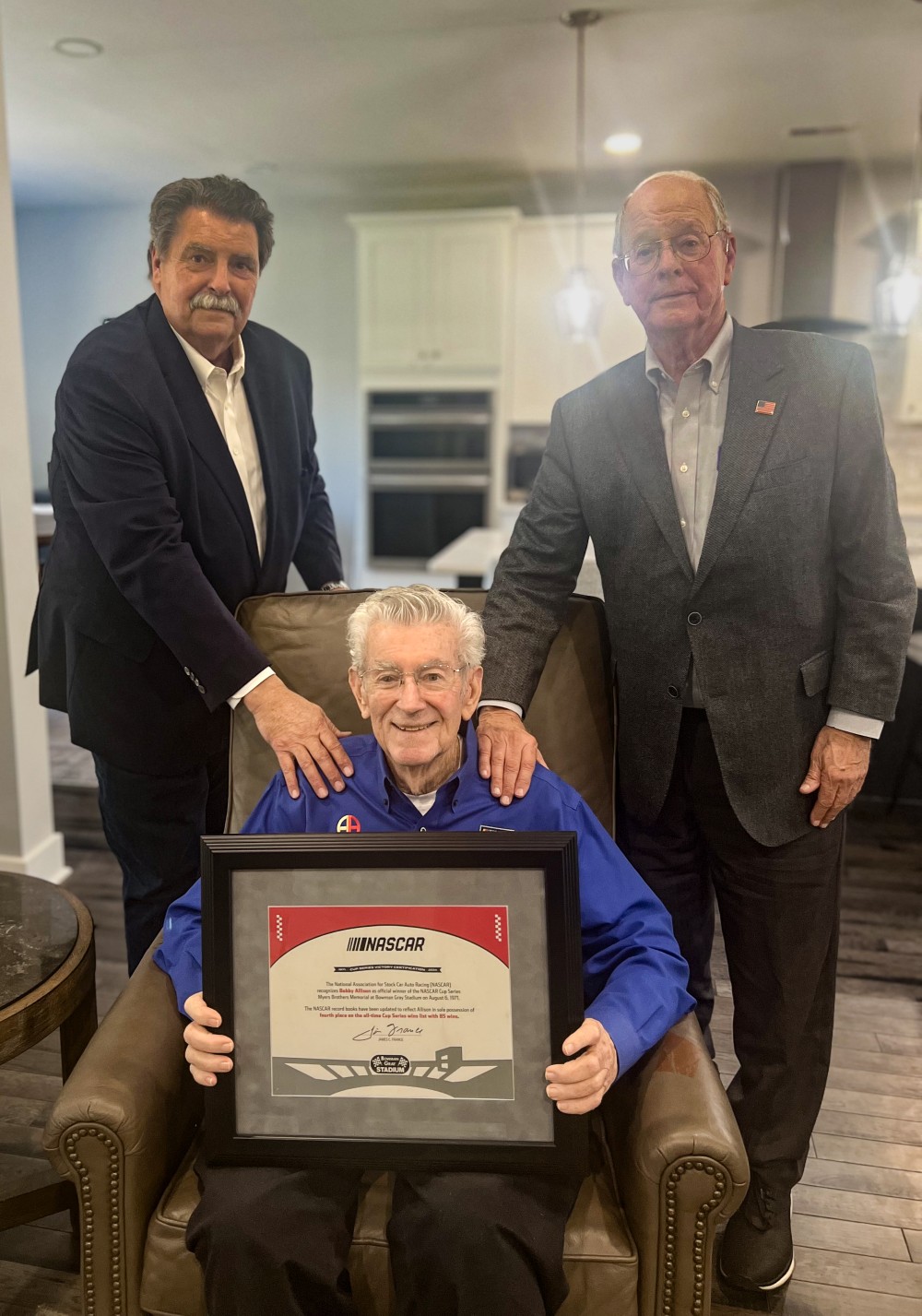 Mike Helton and Jim France with Bobby Allison as he is awarded his 85th NASCAR Cup win - 53 years late