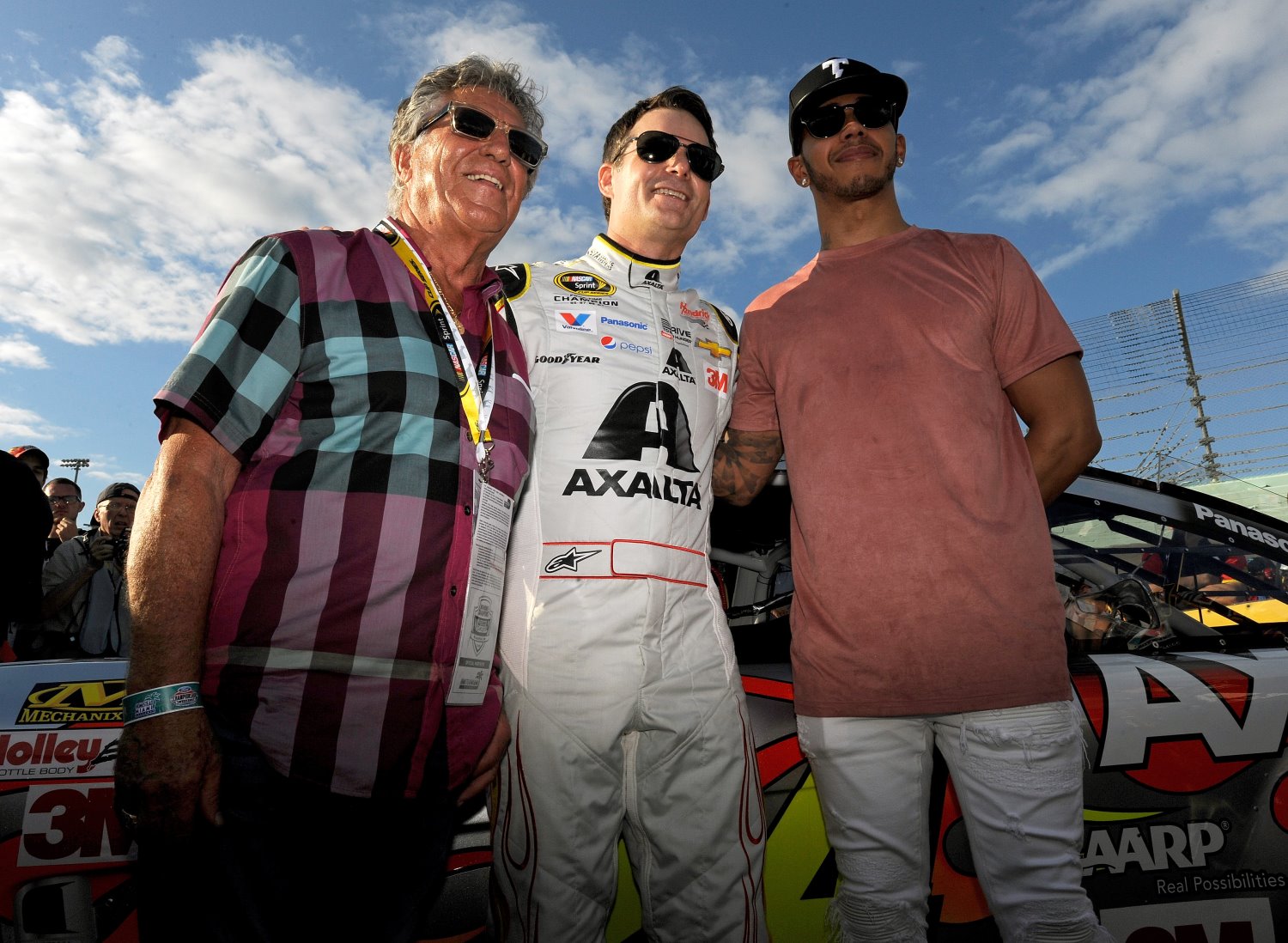 Hamilton (R) at NASCAR's Homestead race with Jeff Gordon and Mario Andretti